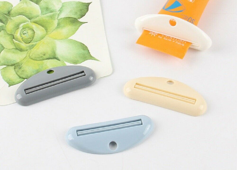 4 Pcs Plastic Tube Squeezer Toothpaste Dispenser Holder Rolling Bathroom Extract